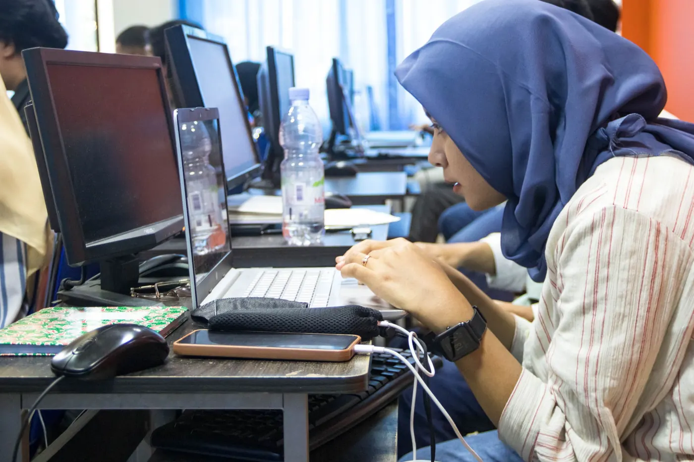 Student working in a university computer lab