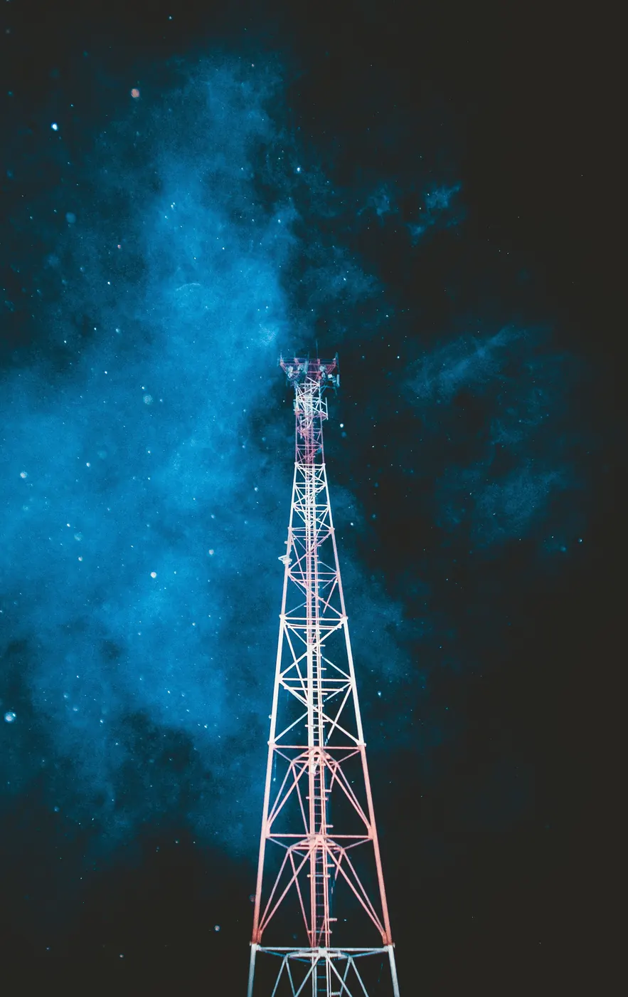 Telecommunications tower under a night sky