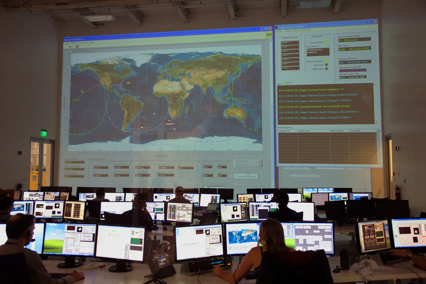 Operations center monitoring systems on a wall of screens