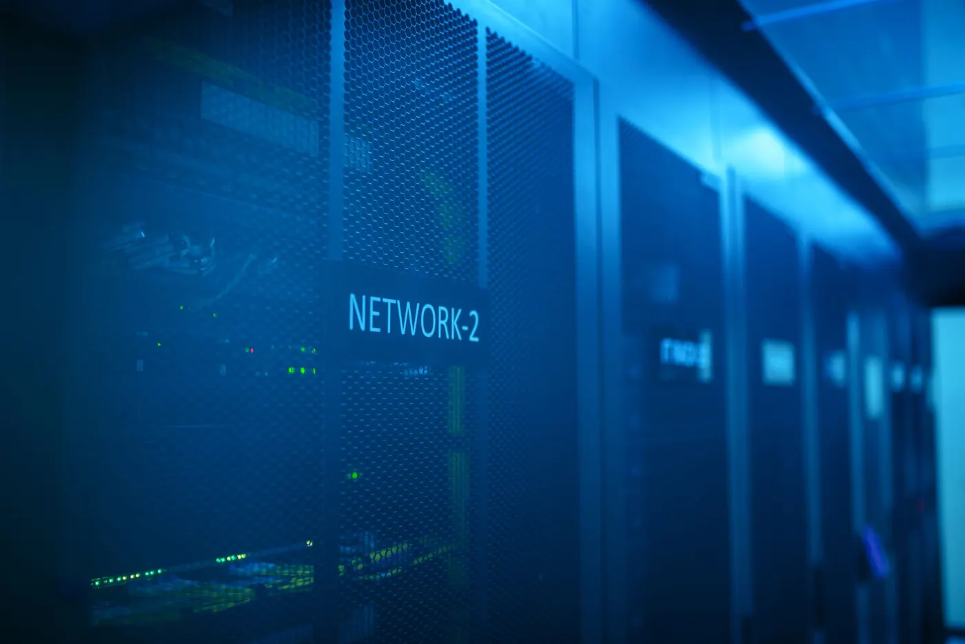 Network equipment glowing in a server room