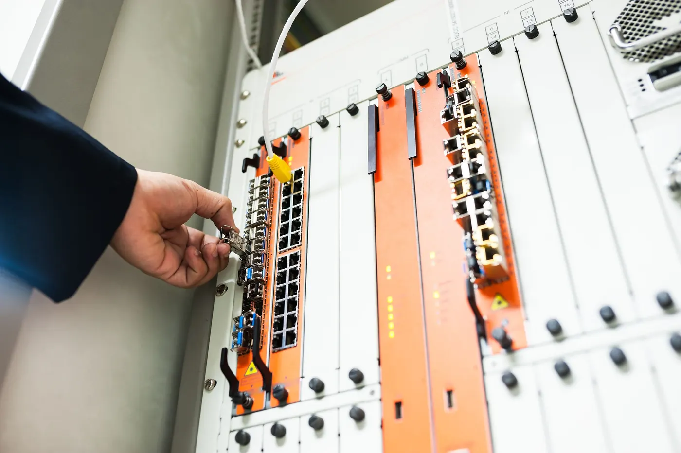 Engineer adjusting a core network switch
